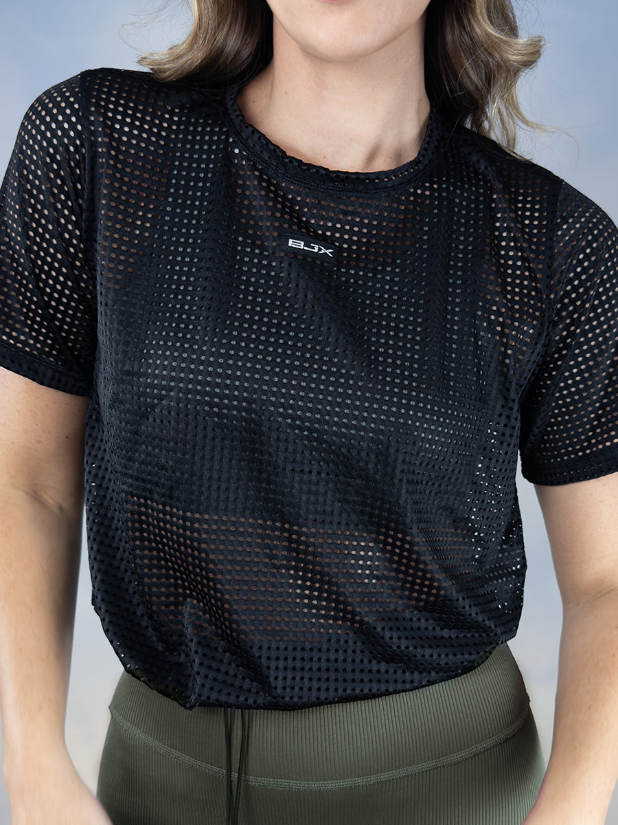 Camiseta deportiva en malla con recogido para dama